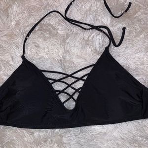 black bathing suit top, criss-cross bathing suit